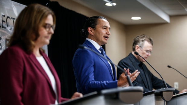 Manitoba provincial party leaders, from left, Heather Stefanson (Progressive Conservative), Wab Kinew (NDP) and Dougald Lamont (Liberal) speak at the Party Leaders Forum – Growing the Economy in Winnipeg, Tuesday, Sept. 12, 2023. THE CANADIAN PRESS/John Woods