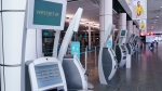 WestJet self service check-in kiosks are seen at Montreal-Trudeau International Airport in Montreal, on Friday, July 31, 2020. THE CANADIAN PRESS/Paul Chiasson