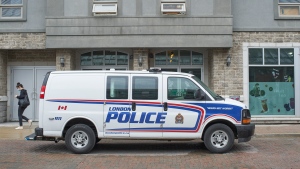 A police van sits outside of an address in London, Ont. on Tuesday, June 8, 2021. The address is linked to Nathaniel Veltman, the suspect in the murder of four members of a Muslim family on Sunday. THE CANADIAN PRESS/ Geoff Robins
