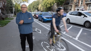 Mario di Chiaro stands next to the bike path he is fighting to have removed in the densely populated neighbourhood of Parc-Extension, Friday, Sept. 29, 2023, in Montreal. THE CANADIAN PRESS/Ryan Remiorz