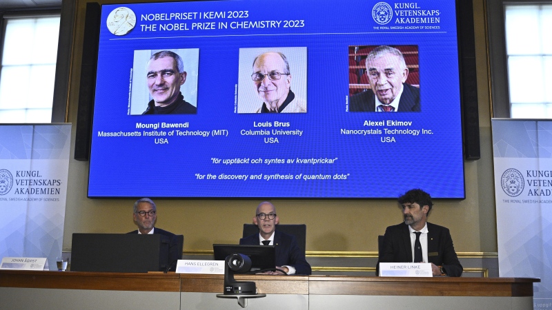 Permanent Secretary of the Royal Academy of Sciences Hans Ellegren, center, announces the winner of the 2023 Nobel Prize in Chemistry, at the Royal Academy of Sciences, in Stockholm, Wednesday, Oct. 4, 2023. (Claudio Bresciani/TT News Agency via AP)