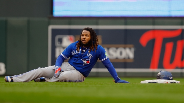 Toronto Blue Jays' Vladimir Guerrero Jr. reacts after being picked off second base during the fifth inning of Game 2 of an AL wild-card baseball playoff series against the Minnesota Twins Wednesday, Oct. 4, 2023, in Minneapolis. (AP Photo/Bruce Kluckhohn)