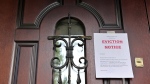 This stock image shows a door with an eviction notice on it. (Credit: Shutterstock) 
