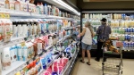 People shop inside a Metro grocery store in Toronto, Tuesday, July 18, 2023. (THE CANADIAN PRESS/Cole Burston)