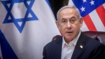Israeli Prime Minister Benjamin Netanyahu speaks during a meeting with U.S. President Joe Biden in Tel Aviv, Israel, Wednesday, Oct. 18, 2023. (Miriam Alster/Pool Photo via AP)