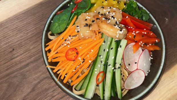 A Thai Shrimp Bowl from Grains and Greens Just Walk Out, one of Scotiabank Arena's first 'Just Walk Out' Marketplaces  in the 100 level, section 101, is a Pad Thai noodle bowl with an assortment of vegetables, shrimp and ginger sambal dressing.  It is one of the new concession offerings available to fans during the 2023-2024 Maple Leafs and Raptors season. (CP24/Jess Smith)  