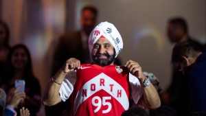 Toronto Raptors superfan Nav Bhatia shows his support for the team during the Eid Dinner hosted by The Canadian-Muslim Vote, in Toronto, on Friday, June 21, 2019. THE CANADIAN PRESS/Andrew Lahodynskyj