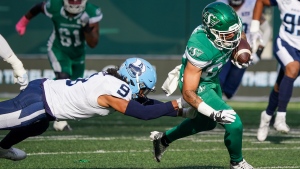 Saskatchewan Roughriders receiver Jerreth Sterns (83) is tackled by Toronto Argonauts defensive back Royce Metchie (9) during the first half of CFL football action in Regina, Sask., on Saturday, October 21, 2023. THE CANADIAN PRESS/Heywood Yu