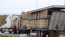 A commercial truck is seen after hitting a highway overpass in Langley on Tuesday. 