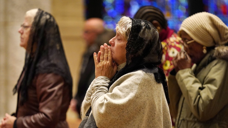 Mainers gather for Sunday mass to pray, reflect days after a mass shooting left 18 dead