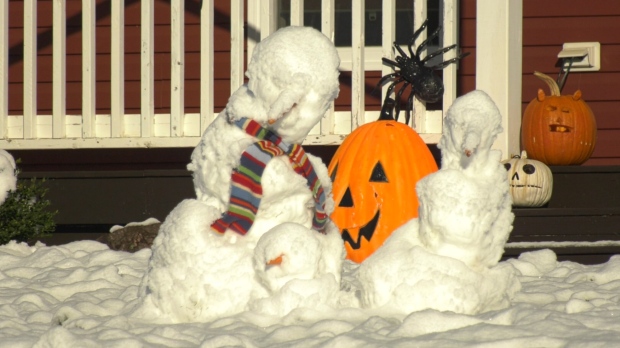 A family of snowmen are pictured in Moncton, N.B., on Oct. 31, 2023.