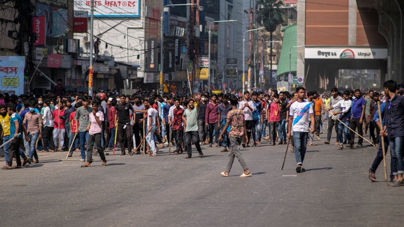 Thousands of Bangladesh's garment factory workers take to the streets demanding better wages