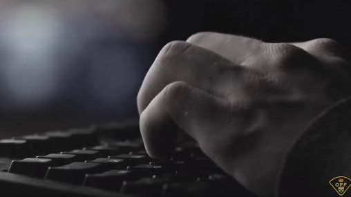 Hands on a computer keyboard (Ontario Provincial Police)