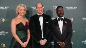 Britain's Prince William, Hannah Waddingham, left, and Sterling K. Brown pose on the green carpet for the 2023 Earthshot Prize Awards in in Singapore, Tuesday, Nov. 7, 2023. (Vincent Thian/AP Photo)