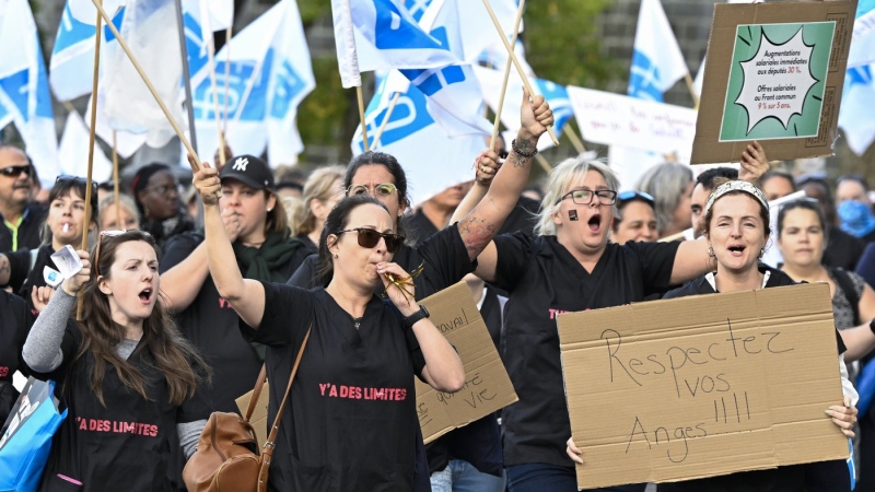 Union members of the Federation interprofessionnelle de la sante du Quebec (FIQ) march to the National Assembly to demonstrate, in Quebec City, Monday, Oct. 2, 2023. (THE CANADIAN PRESS/Jacques Boissinot)