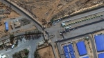 This image provided by Maxar Technologies shows a close view of the Rafah border crossing between Gaza and Egypt, with humanitarian-associated trucks lined up at and near the border, Tuesday, Nov. 7, 2023. (Satellite image ©2023 Maxar Technologies via AP)