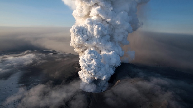 An aerial view showing the crater spewing ash and plumes of grit at the summit of the volcano in southern Iceland's Eyjafjallajokull glacier, Saturday, April 17, 2010. (AP Photo/Arnar Thorisson/Helicopter.is)
