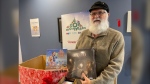 Joe Vaillancourt, who is one of Santa’s helpers, dropped by with an early Toy Mountain donation.  A big thanks from all of us. 