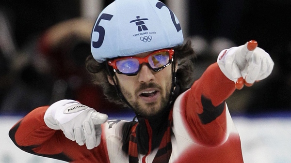 Charles Hamelin reacts after winning the gold medal in the men's 500m short track skating competition at the 2010 Olympics in Vancouver, B.C., on Friday, Feb. 26, 2010. (AP / Amy Sancetta)