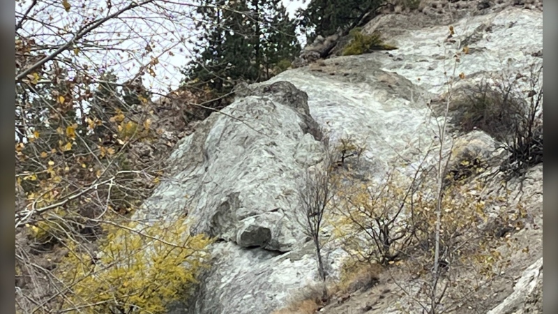 The City of Penticton says it has temporarily evacuated 24 properties in a mobile home park over fears of a potential rock slide. The rock in question is pictured. (x.com/@cityofpenticton)
