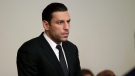 Boston Bruins forward Milan Lucic stands during his arraignment, Nov. 21, 2023, in Boston Municipal Court, in Boston, on an assault charge in connection with his arrest over the weekend after his wife called police to their home and said he tried to choke her. (Jonathan Wiggs/The Boston Globe via AP, Pool)