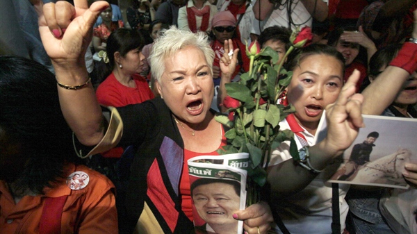 Supporters of deposed Prime Minister Thaksin Shinawatra shout slogans at Pheu Thai Party in Bangkok, Thailand, on Friday, Feb. 26, 2010. (AP Photo/Sakchai Lalit)