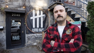 Sergio Da Silva, co-owner of the Turbo Haüs nightclub, poses for photos in front of the club Friday, Nov. 24, 2023, in Montreal. The club has received warnings related to noise complaints from the city, a problem affecting many small music venues in Montreal. THE CANADIAN PRESS/Ryan Remiorz
