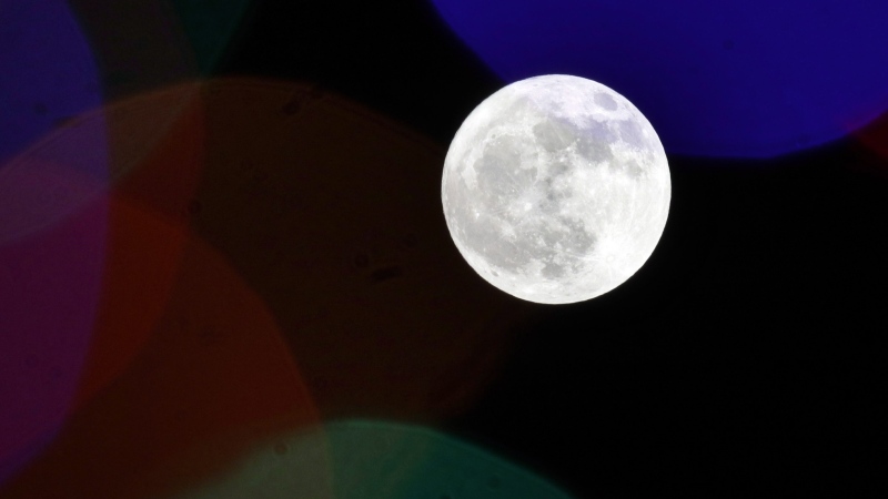 The full moon rises in Lawrence, Kan., Thursday, Nov. 22, 2018. (AP Photo/Orlin Wagner/File)