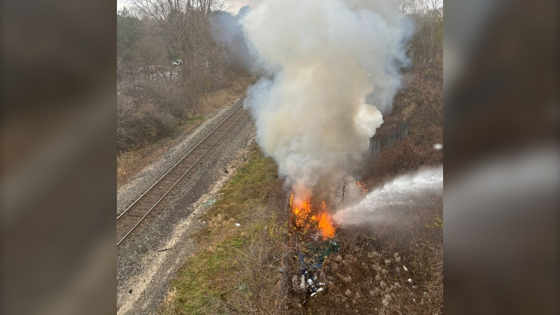 Fire crews tackled a small fire at a homeless encampment in the area of Wonderland and Sarnia roads in London, Ont. on Nov. 27, 2023. (Source: London Fire Department/X)