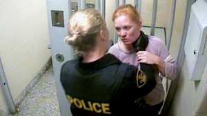 Security video from inside a holding cell in Orillia, Ont., on Sept. 7, 2019, shows an encounter between OPP Const. Bailey Nicholls and Shannon Hoffman. (Source: Court Exhibit)