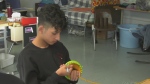Students at F.J. Brennan High School have been loom knitting and creating scarfs, toques and gloves with hand warmers to give to those experiencing homelessness in Windsor, Ont. on Tuesday, Nov. 28, 2023. (Bob Bellacicco/CTV News Windsor)