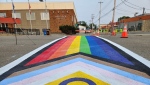 A crosswalk in Westlock, Alta., that was painted in Pride colours in June 2023 in an event attended by hundreds of people. (Credit: George Blais/Westlock Town and Country Today)
