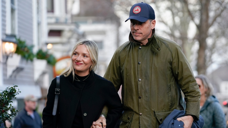 Hunter Biden walks with wife Melissa Cohen as they visit shops with President Joe Biden and first lady Jill Biden in Nantucket, Mass., Friday, Nov. 24, 2023. (AP Photo/Stephanie Scarbrough)