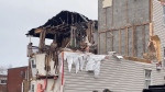 Workers have started demolishing an apartment building that was destroyed by a fire in February. (Jackie Perez/CTV News Ottawa)