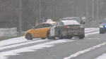 A London taxi cab is seen surrounded by OPP vehicles on Highway 3 near Aylmer on Nov. 29, 2023 during an alleged theft. (Gerry Dewan/CTV News London) 