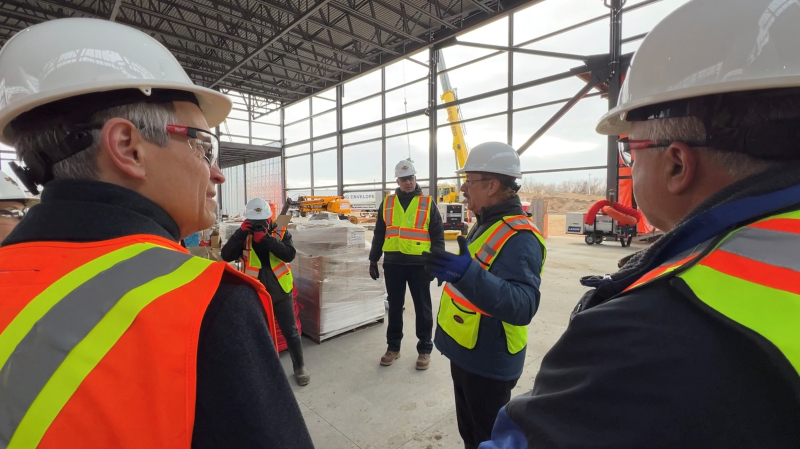 Hard Rock Hotel & Casino, C.O.O., Jon Lucas (centre), provides a tour of the construction progress of its new Ottawa location, to community members including Mayor Mark Sutcliffe (left) and councilor George Darouze (right). Ottawa, On.. Nov. 29, 2023. (Tyler Fleming / CTV News).