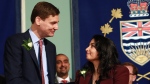 B.C. Attorney General Niki Sharma is congratulated by Premier David Eby after being sworn in during a ceremony at Government House in Victoria, B.C., on Wednesday, December 7, 2022. THE CANADIAN PRESS/Chad Hipolito