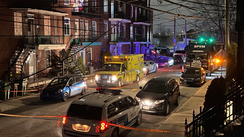 Police cruisers outside a home near the corner of Duranceau Avenue and Des Érables Street in Lahcine after a man was found dead on Wednesday, Nov. 29, 2023. (Cosmo Santamaria/CTV News)
