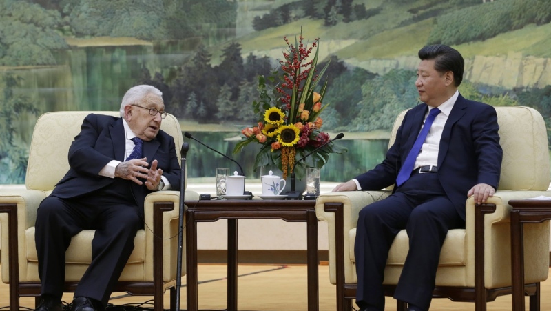China's President Xi Jinping, right, listens to former U.S. Secretary of State Henry Kissinger, who led the China-U.S Track Two Dialogue, during a meeting at the Great Hall of the People in Beijing, China, Nov. 2, 2015. (Jason Lee/Pool Photo via AP, File)