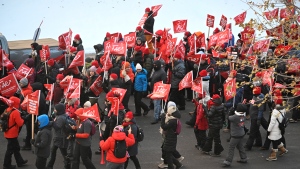 Teachers, members of the FAE union, march by the National Assembly and the Education ministry, Wednesday, Nov. 29, 2023 at the legislature in Quebec City. THE CANADIAN PRESS/Jacques Boissinot