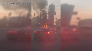 Viewer video shows flames at the corner of Victoria and Weber streets in Kitchener on Nov. 30, 2023. (Submitted/Hannah Kavanagh)