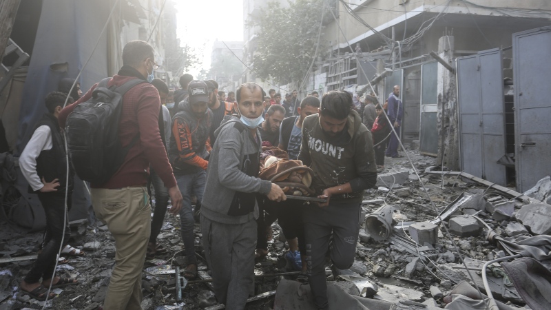 Palestinians evacuate wounded following the Israeli bombardment of Rafah, Gaza Strip, Friday, Dec. 1, 2023. (AP Photo/Hatem Ali)