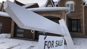 A house for sale sign is shown in front of a house in Oakville, Ont., west of Toronto on Sunday, Feb.5, 2023.THE CANADIAN PRESS/Richard Buchan