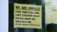 A sign for help wanted is pictured in a business window in Ottawa on Tuesday, July 12, 2022. THE CANADIAN PRESS/Sean Kilpatrick