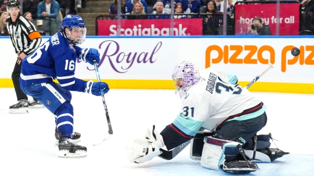 Toronto Maple Leafs' Mitchell Marner scores against Seattle Kraken goaltender Philipp Grubauer during second period NHL hockey action in Toronto, on Thursday, November 30, 2023. THE CANADIAN PRESS/Chris Young