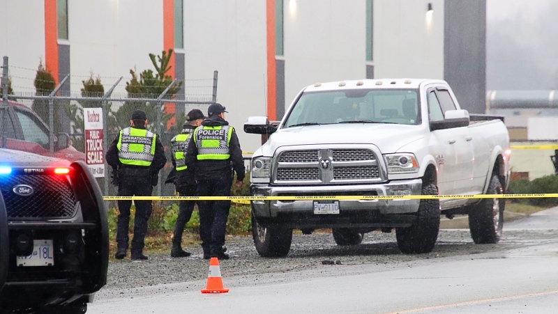 Police and first responders are seen at the scene of a crash that left a pedestrian critically injured on Dec. 1, 2023. 