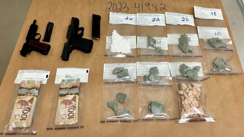 Mounties seized two handguns and a large amount of illicit drugs during a traffic stop in Kamloops earlier this week.