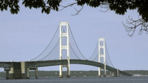 FILE - This July 19, 2002, file photo, shows the Mackinac Bridge that spans the Straits of Mackinac from Mackinaw City, Mich. Michigan regulators have approved a $500 million plan to encase a portion of an oil pipeline that runs beneath a channel connecting two Great Lakes. The state Public Service Commission on Friday, Dec. 1, 2023, approved the proposal for the tunnel through the Straits of Mackinac. (AP Photo/Carlos Osorio, File)