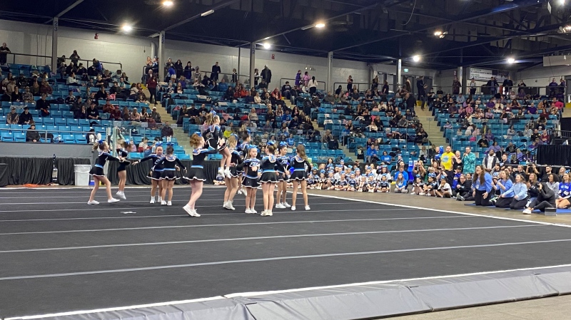 A cheerleading team performs in front of spectators at the cheerleading competition in the Moncton Coliseum. (CTV/Alana Pickrell)