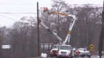 Crews make repairs to a hydro pole in the Municipality of Central Elgin, Ont. after a driver crashed into it on Dec. 3, 2023. (Brent Lale/CTV News London) 